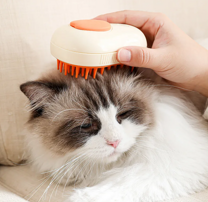 Person using the 3 In 1 Steam Pet Grooming Brush on a fluffy cat for grooming and relaxation.